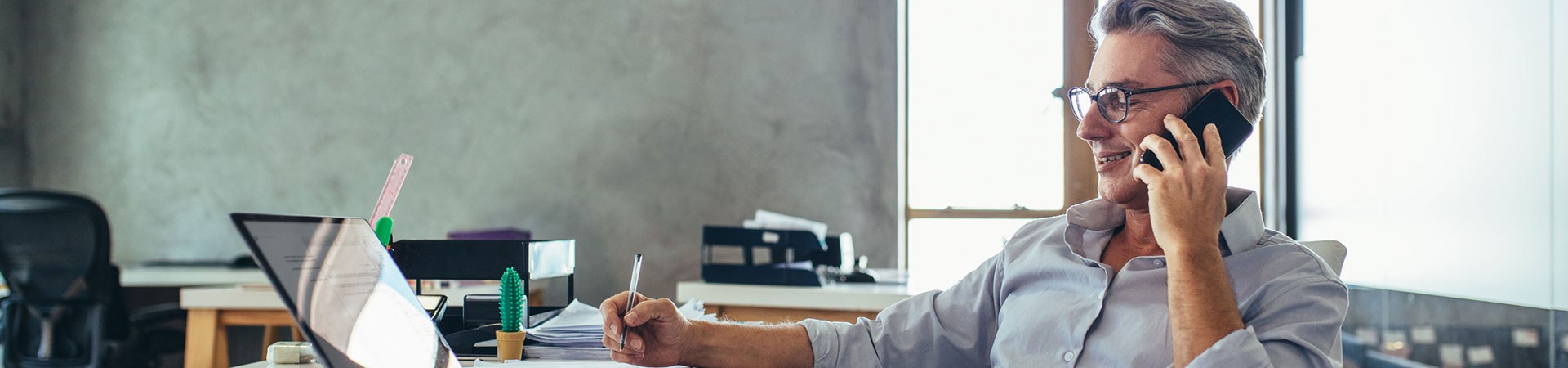 Businessman making a phone call in his office