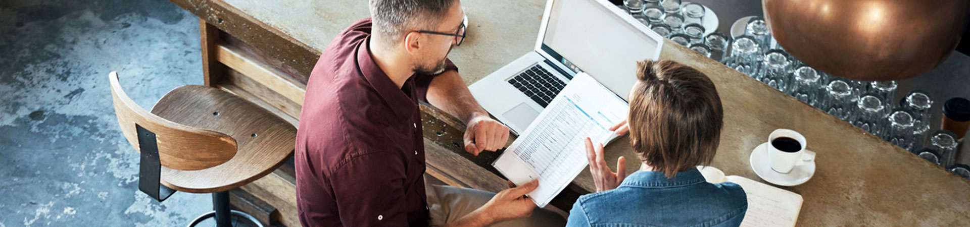 Man and lady discussing a business loan in a restaurant